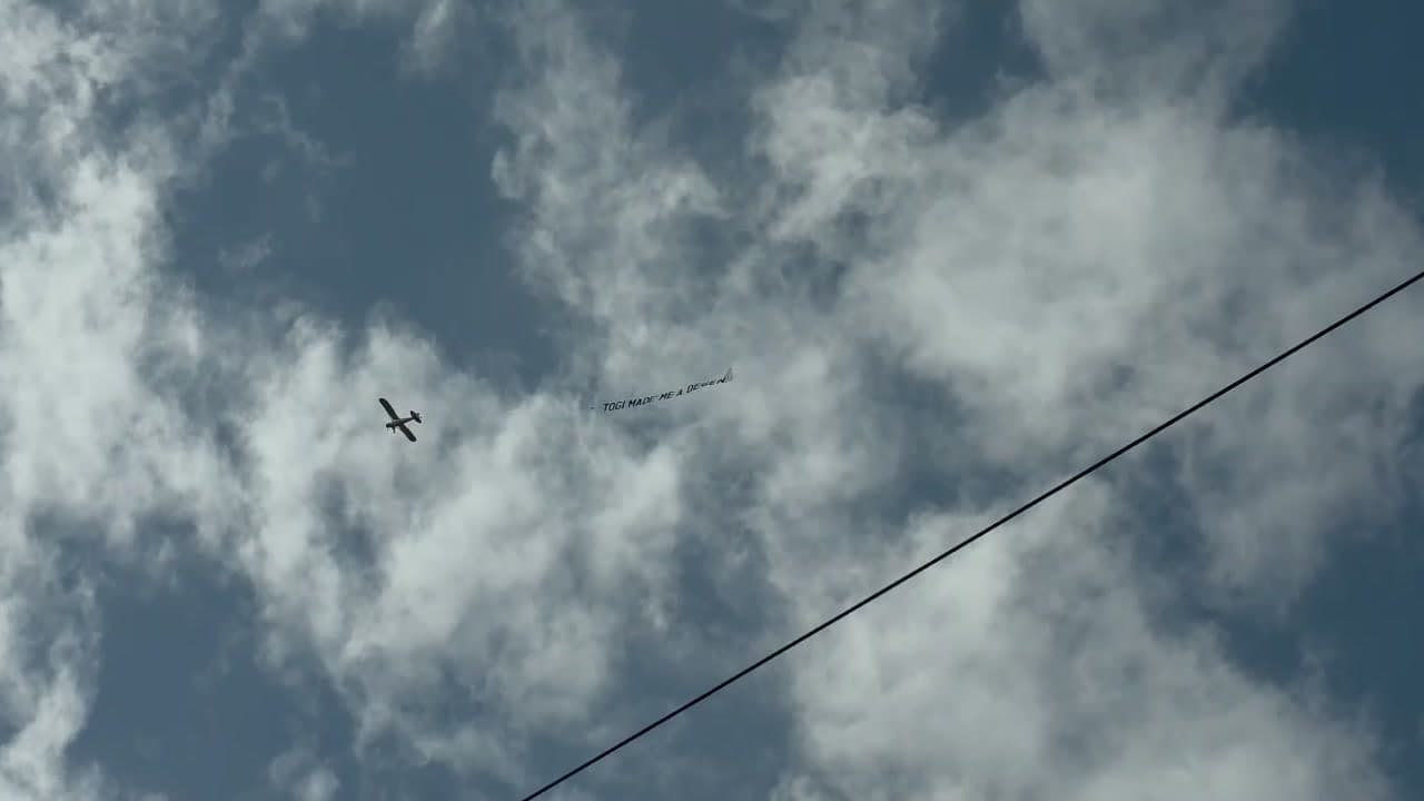 Crypto aerial banner plane advertising over Amsterdam