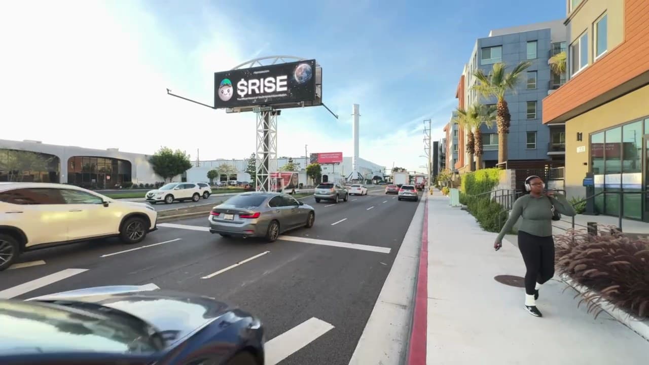 Crypto $RISE billboard beside the SpaceX factory in Los Angeles